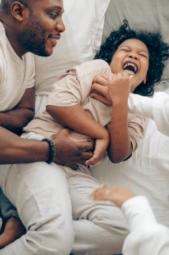 A child being tickled.