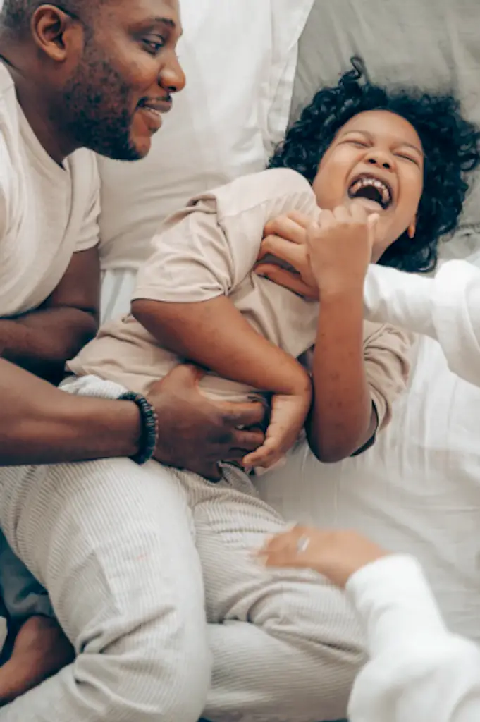 A child being tickled.