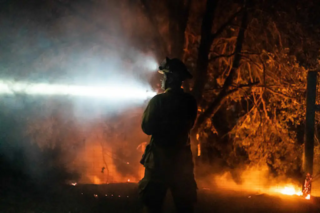 September 29, 2020, Angwin, California, USA: Firefighter ABRAHAM GARCIA signals to a water tender truck on Tuesday. (Credit Image: © Paul Kuroda/ZUMA Wire)