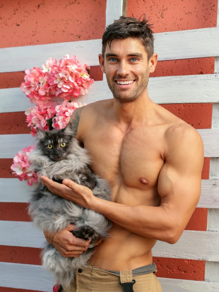 Firefighter Richard with Billie the Cat. These salacious yet cute images depict hunky Australian firefighters posing with some of the most adorable animals Australia has to offer, for a caldendar all in the name of charity. See SWNS story SWBRcalendar. This saucy 2021 calendar depicts hunky Australian firefighters posing with some of the most adorable animals Australia has to offer. Now in its 28th year, the world’s most popular calendar is back for 2021. And after the year we’ve all had, the Australian Firefighters Calendar is certainly a sight for sore eyes. The annual calendar sets out to change the mood of doom and gloom from the past 8-months. 2019 and early 2020 was a particularly devastating time, and the world grieved with Australia as they suffered through catastrophic bushfires, and an estimated loss of 1 billion animals from the diverse native wildlife. While the fires may have gone, the destroyed bushland has made it impossible for many of the displaced wildlife to return to their natural habitat.