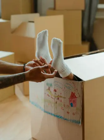 A child having their feet tickled.