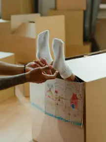 A child having their feet tickled.