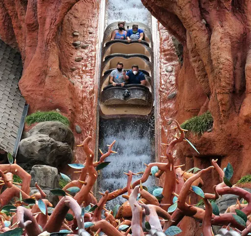 Mask-wearing guests on Disney's Splash Mountain.