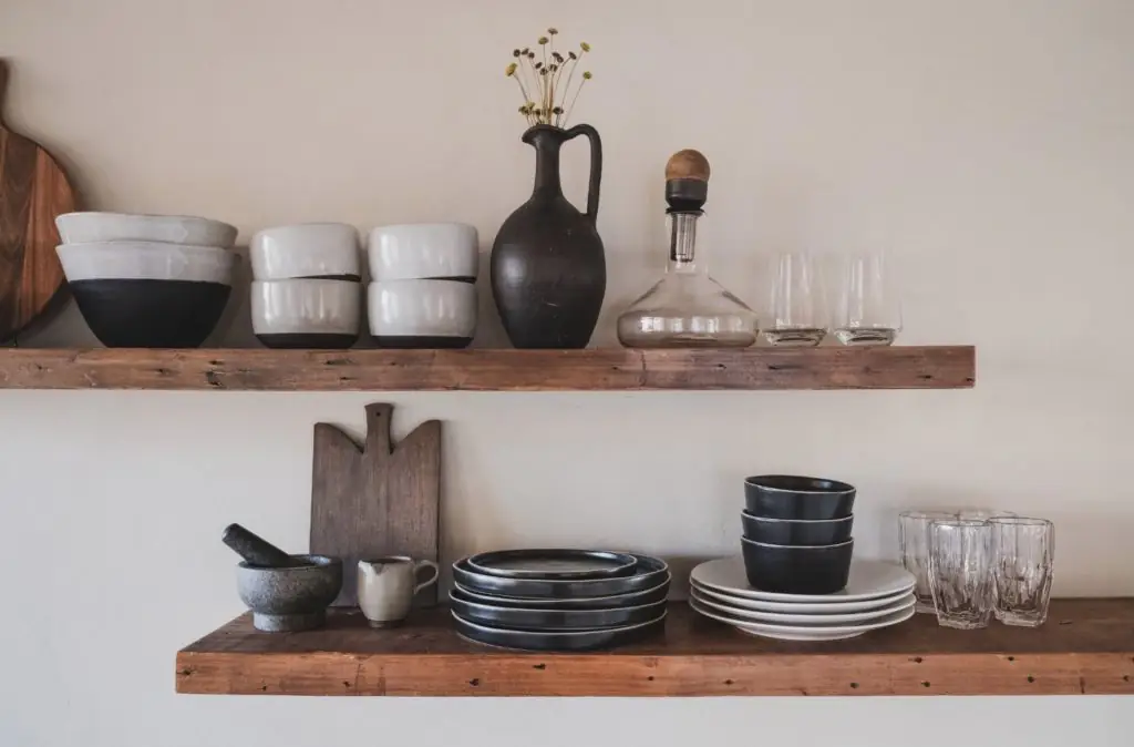 Plates and bowls on a shelf.