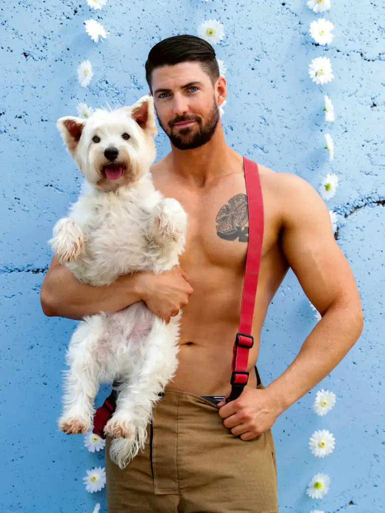 Firefighter Brenden with Frankie the Dog.