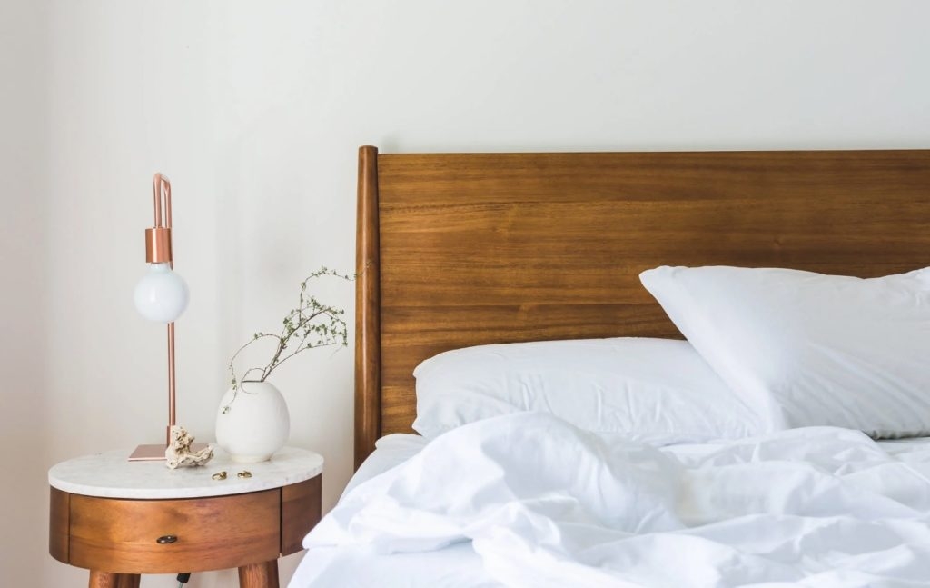 A bed and bedside table.