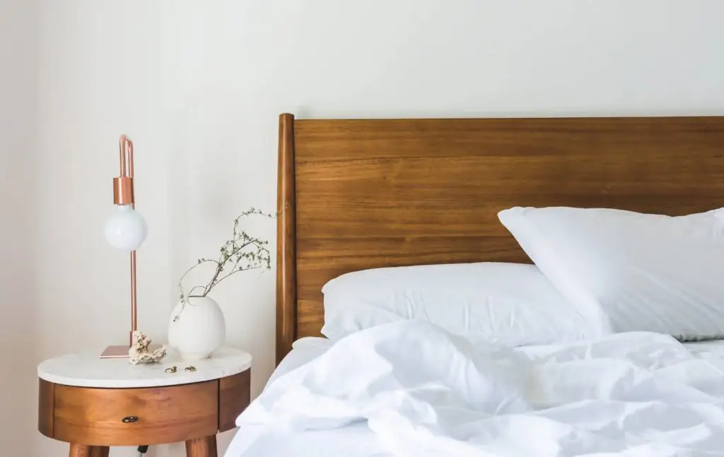 A bed and bedside table.
