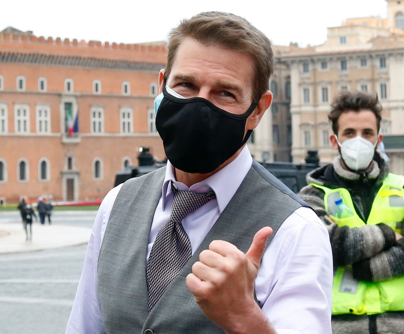 Tom Cruise making a thumbs up.