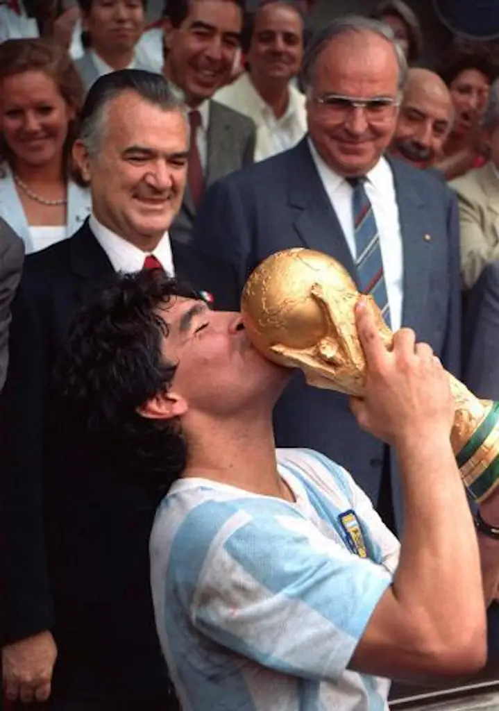 Diego Maradona kisses the World Cup Trophy after captaining Argentina to victory in the 1986 World Cup Finals.