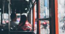 Commuters on a bus.