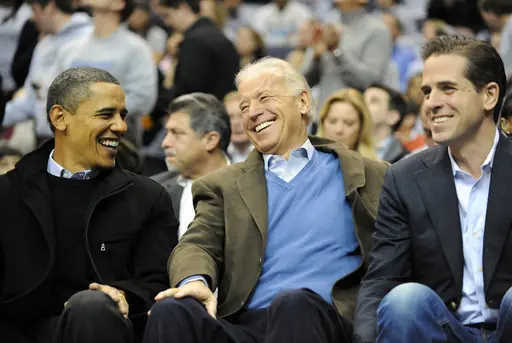 President Barack Obama, left, Vice President Joe Biden, center, and Hunter Biden share a laugh during the first half of the NCAA basketball game between Georgetown and Duke at the Verizon Center in Washington, D.C., Saturday January 30, 2010. Georgetown defeated Duke, 89-77. (Photo by Chuck Myers/MCT/Sipa USA)