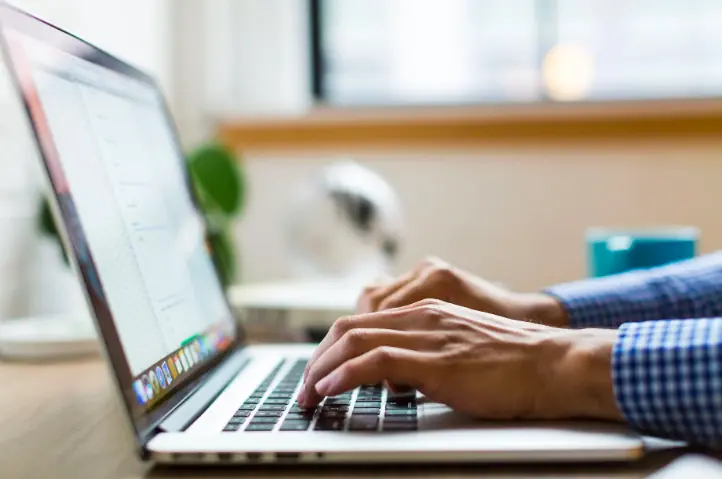 A person using a laptop.