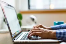 A person using a laptop.