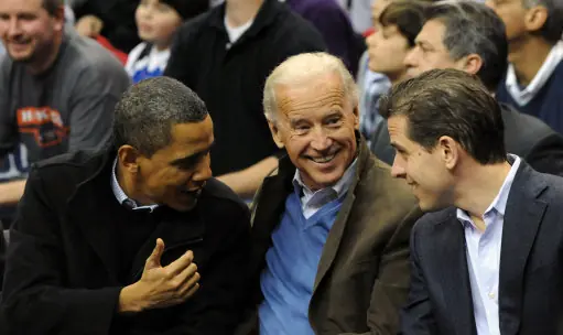 U.S. President Barack Obama (L) greets Vice President Joe Biden (C) and his son Hunter Biden as they attend a college basketball game, Georgetown University vs Duke University, at the Verizon Center in Washington on January 30, 2010. Pool Photo By Alexis C. Glenn/ABACAUSA.COM (Pictured: Barack Obama, Joe Biden, Hunter Biden )