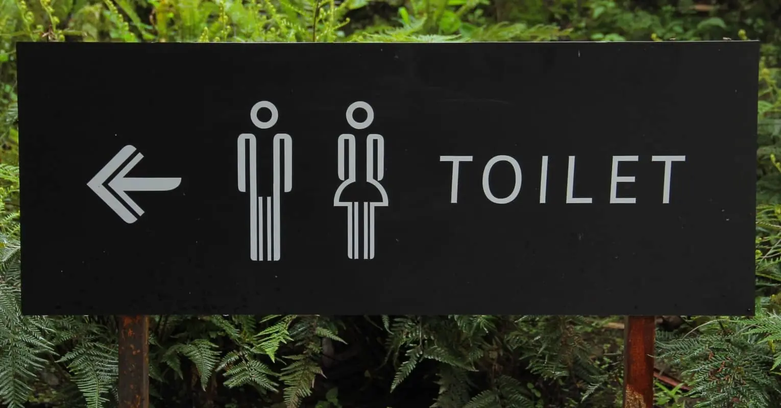 An image of a sign for a toilet. 