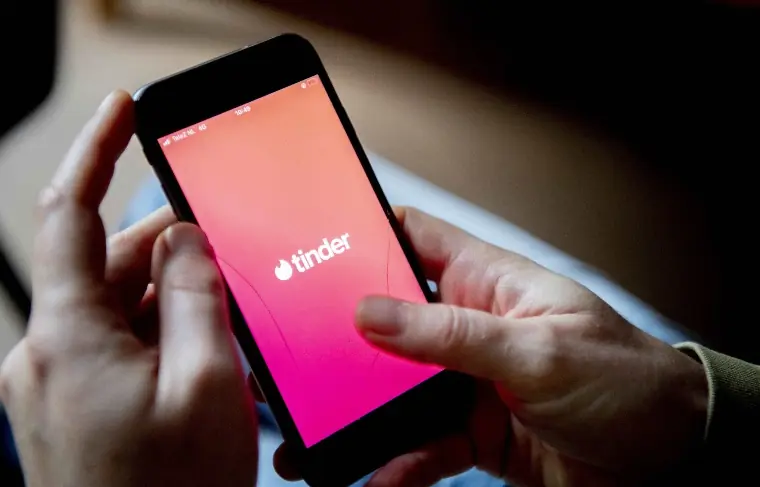 A person using Tinder.
