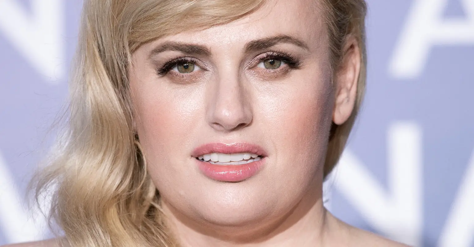 Rebel Wilson highlights her tiny waist in sparkling jumpsuit as she promotes CBD chocolate bars