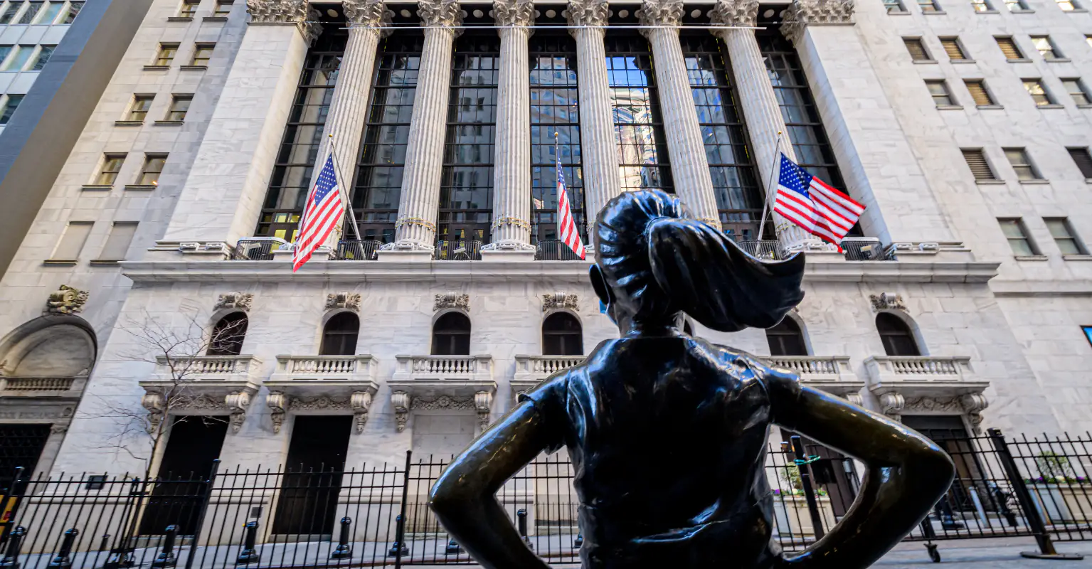 A broken glass ceiling now surrounds the Fearless Girl on Wall Street