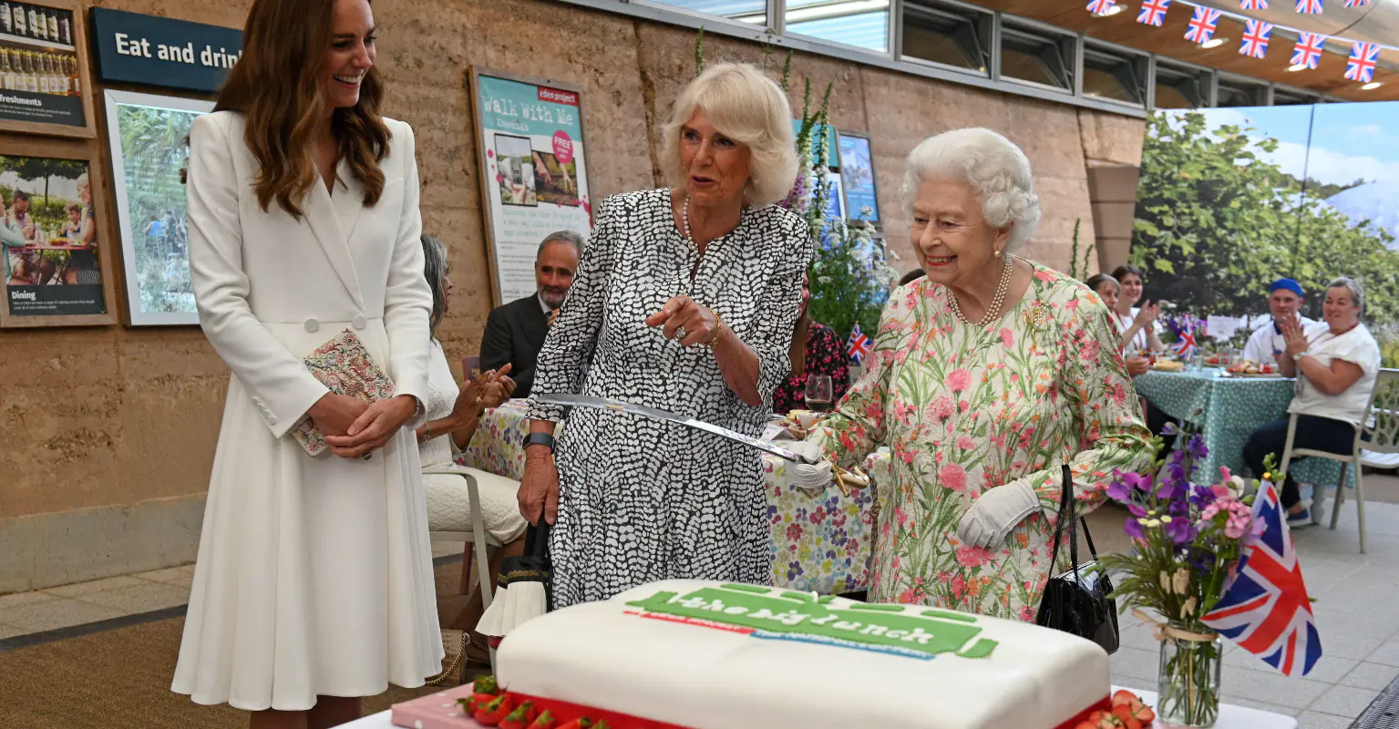 The Queen cuts cake with ceremonial sword after aide tells her she could just use a knife