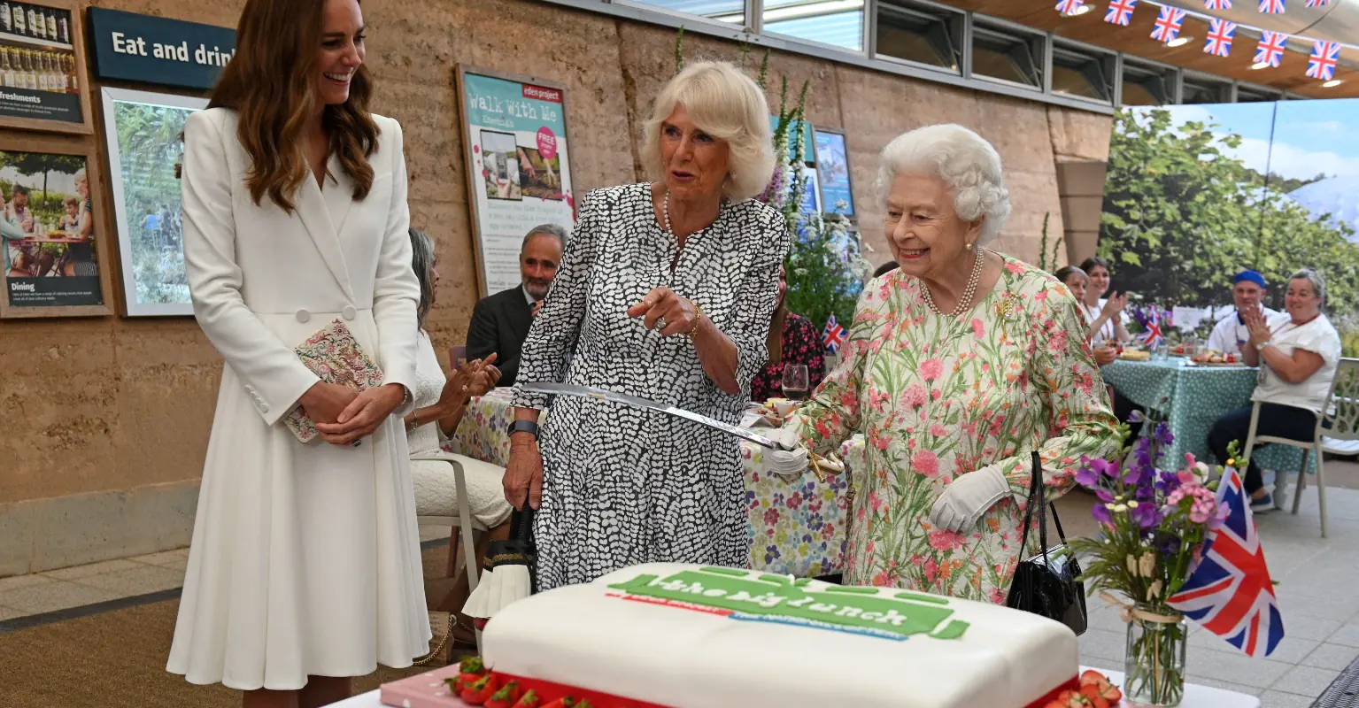 The Queen cuts cake with ceremonial sword after aide tells her she could just use a knife