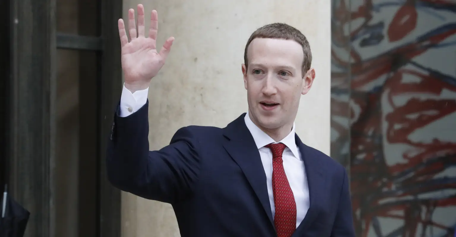 Mark Zuckerberg celebrates July 4th by riding an electric surfboard while holding the US flag
