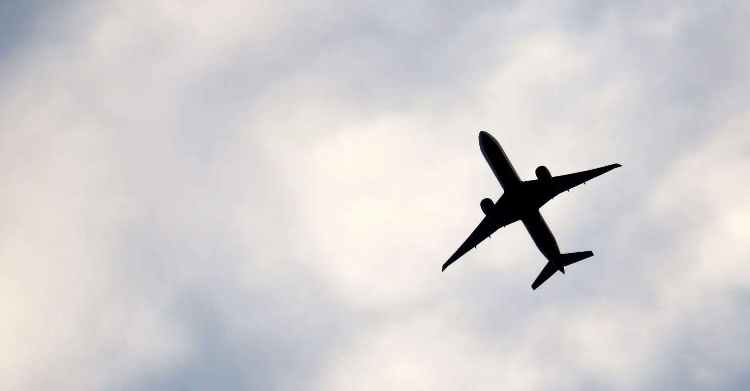 Woman filmed slapping and spitting on 80-year-old passenger during flight has been arrested