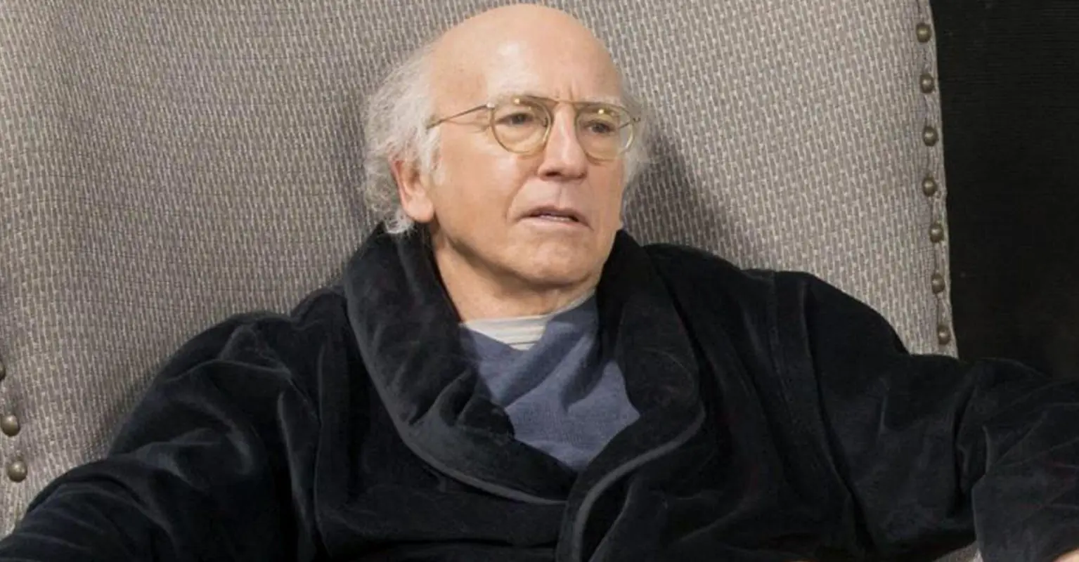 Larry David branded 'iconic' after he is spotted plugging his ears at New York Fashion Week