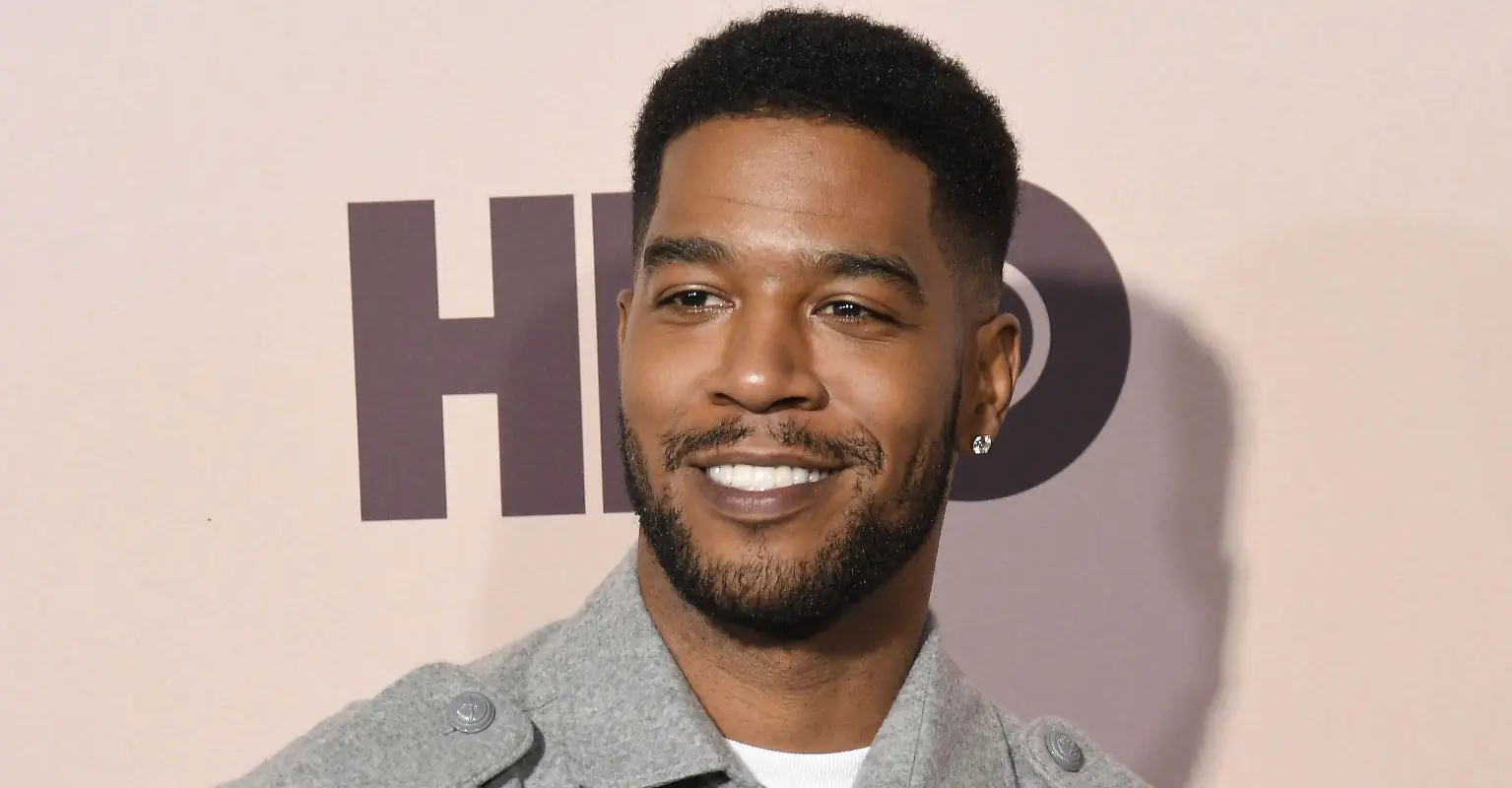 Rapper Kid Cudi praised for wearing white lace wedding dress with a statement veil to CFDA Awards