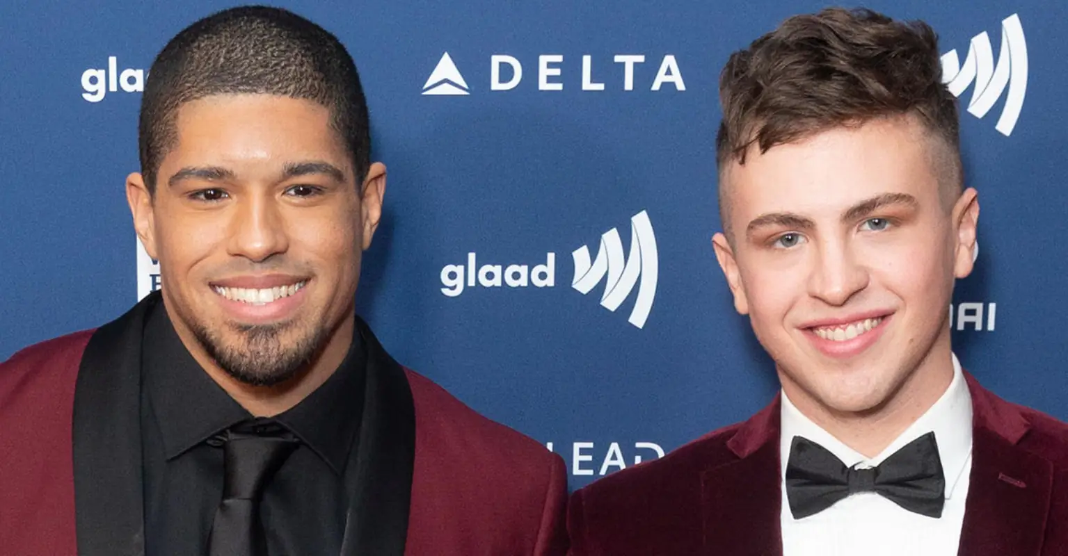 Openly gay wrestler Anthony Bowens defiantly kisses boyfriend in front of homophobic protesters