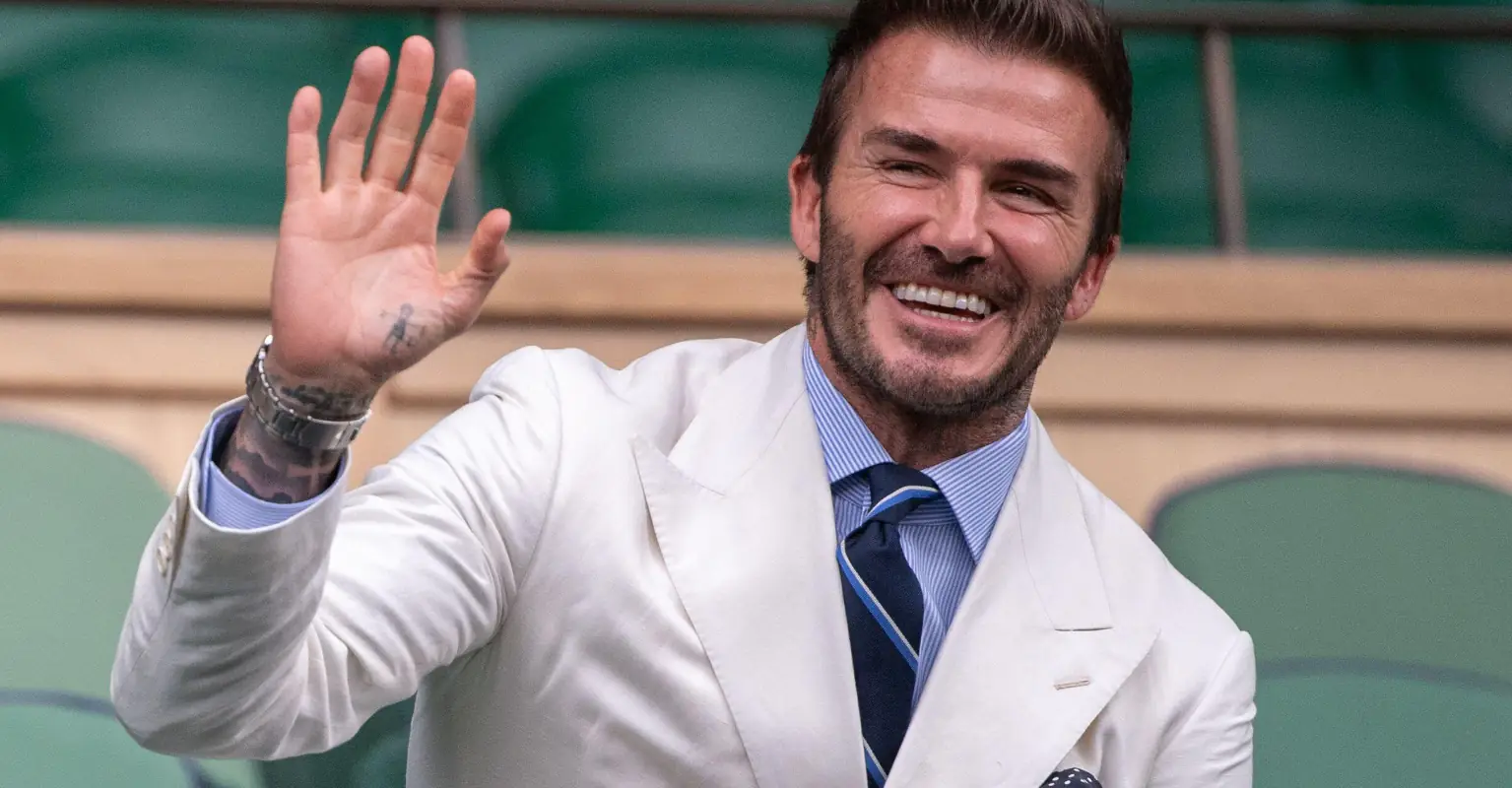 Fans rush to defend David Beckham after he shares pic kissing daughter Harper on the lips