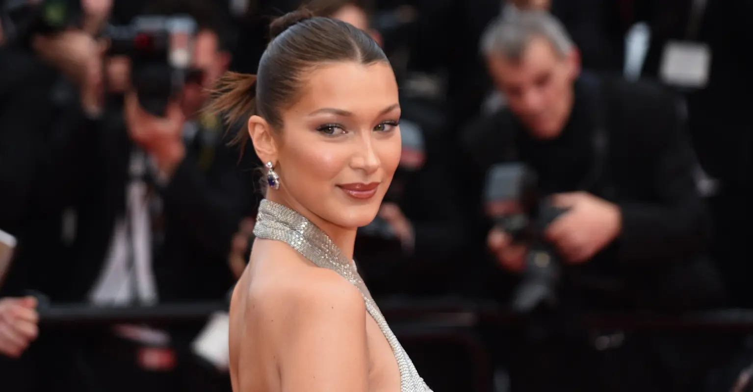 Bella Hadid walks runway with 'dress' spray-painted on her naked body