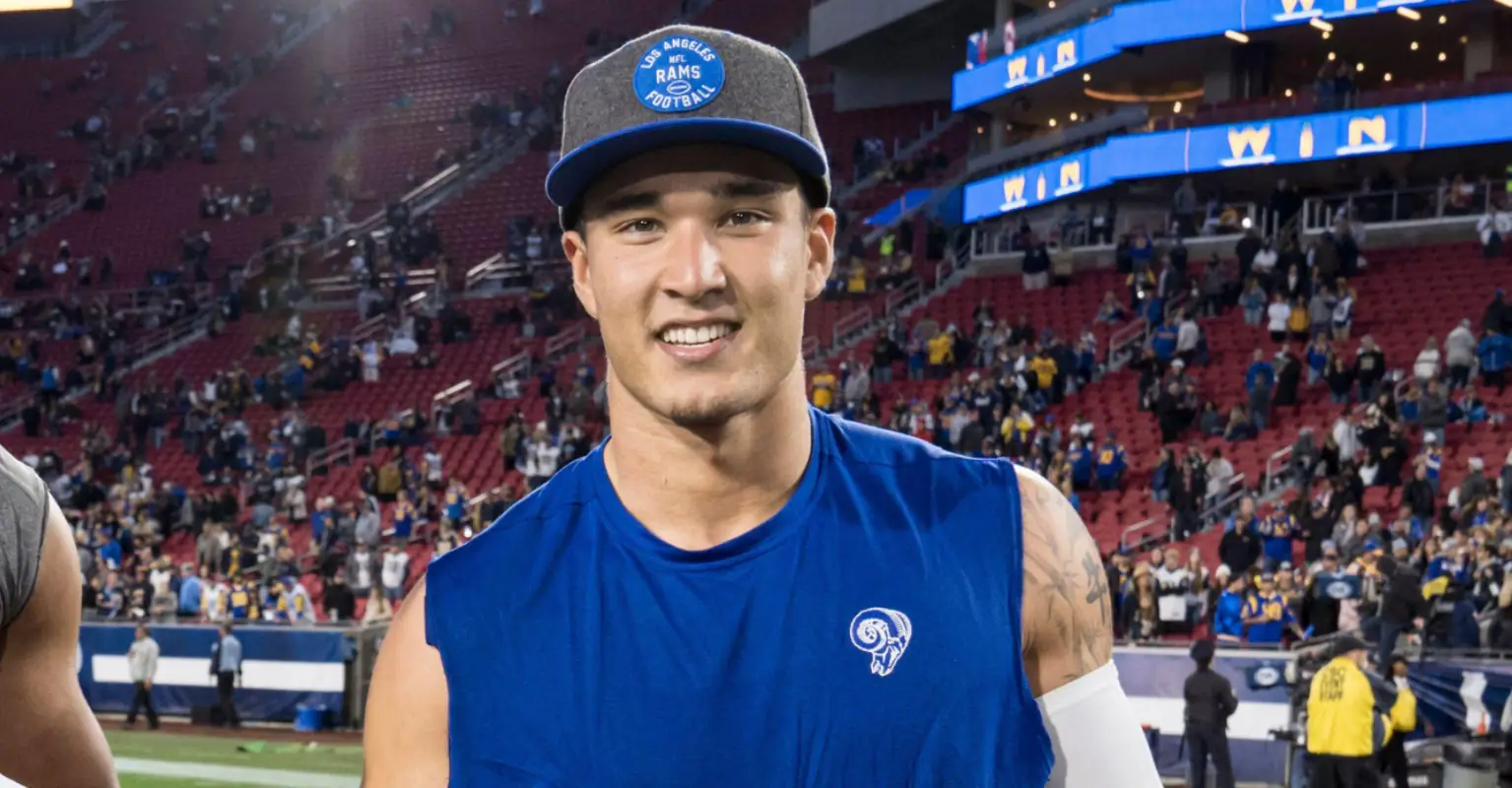 Rams player Taylor Rapp celebrates winning the Super Bowl by proposing to his girlfriend on the field