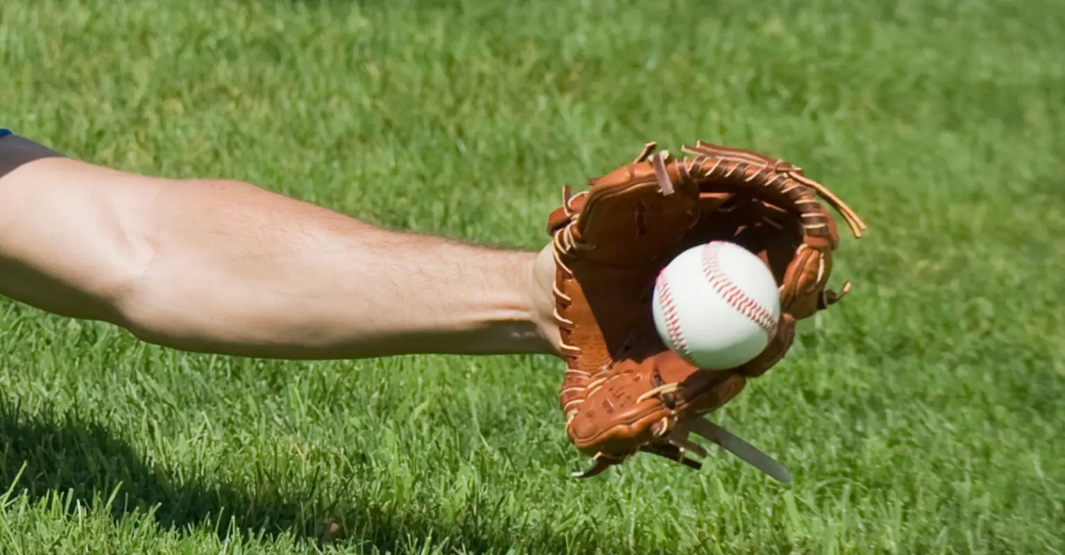'Hero' dad catches foul ball while bottle-feeding newborn baby