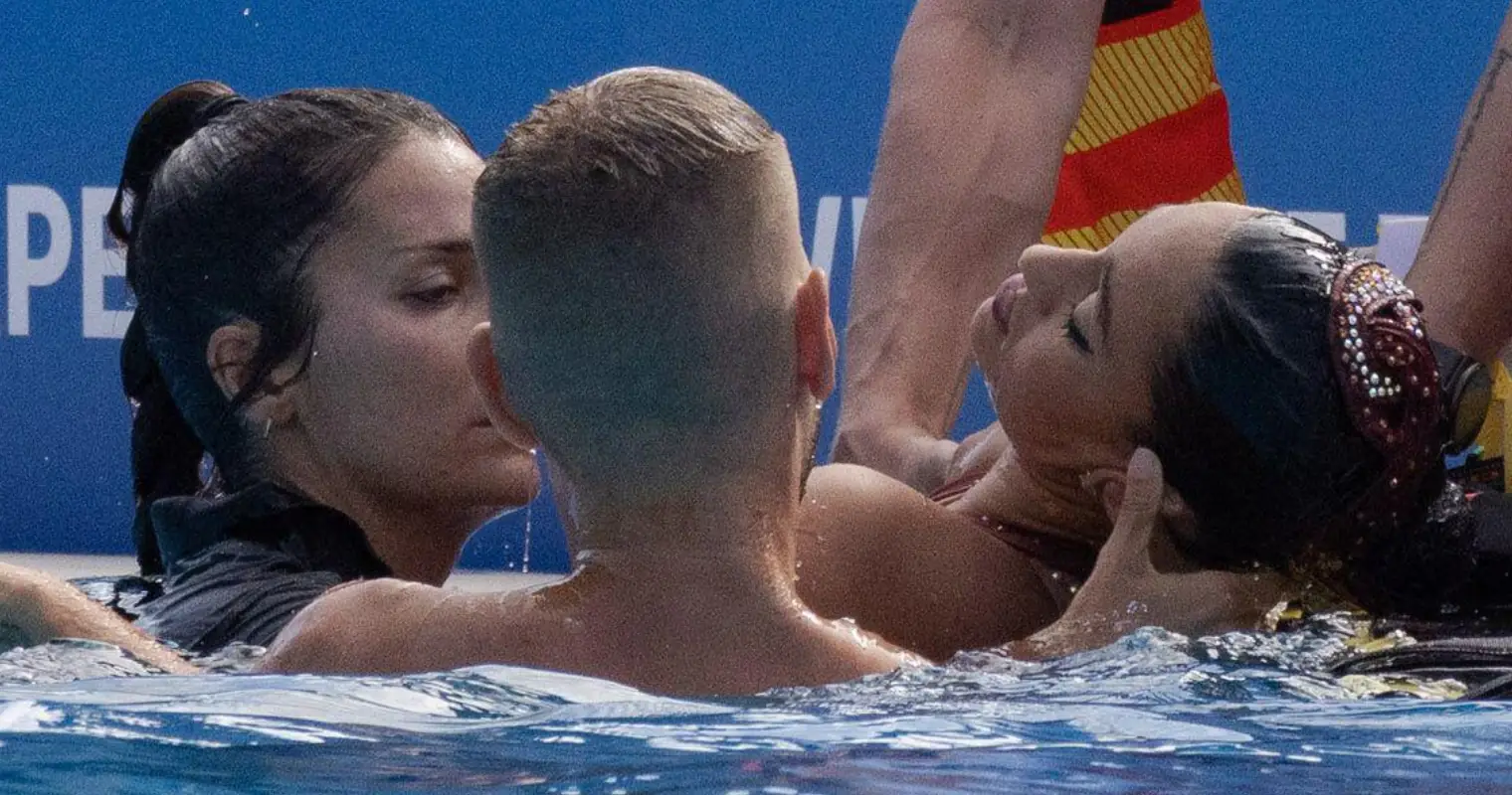 Lifeguards did not initially attempt to save unconscious swimmer due to 'extremely strict FINA rules'