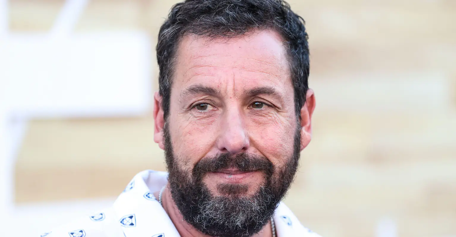 Adam Sandler has hilarious reaction as super tall interviewer shocks Jennifer Aniston