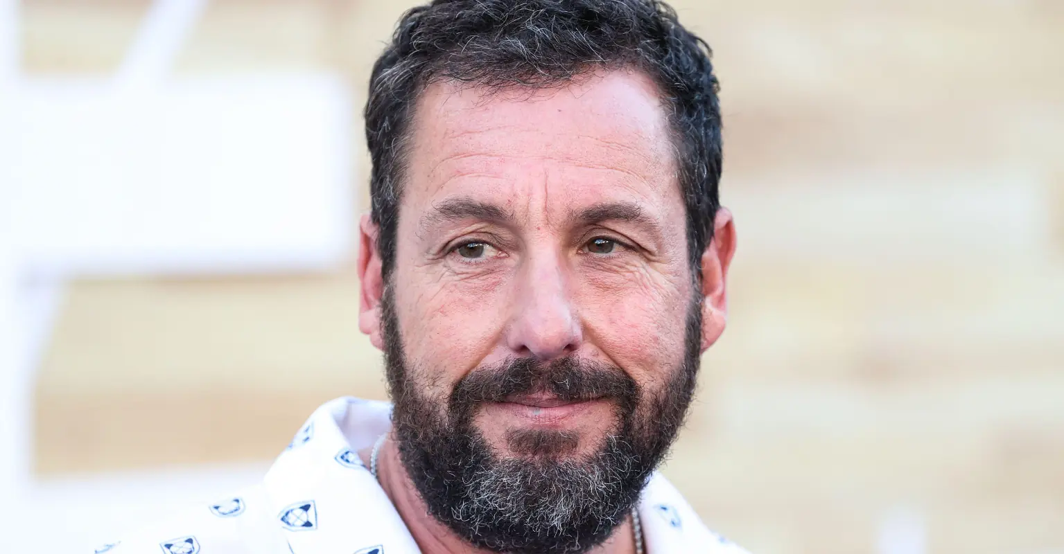 Adam Sandler has hilarious reaction as super tall interviewer shocks Jennifer Aniston
