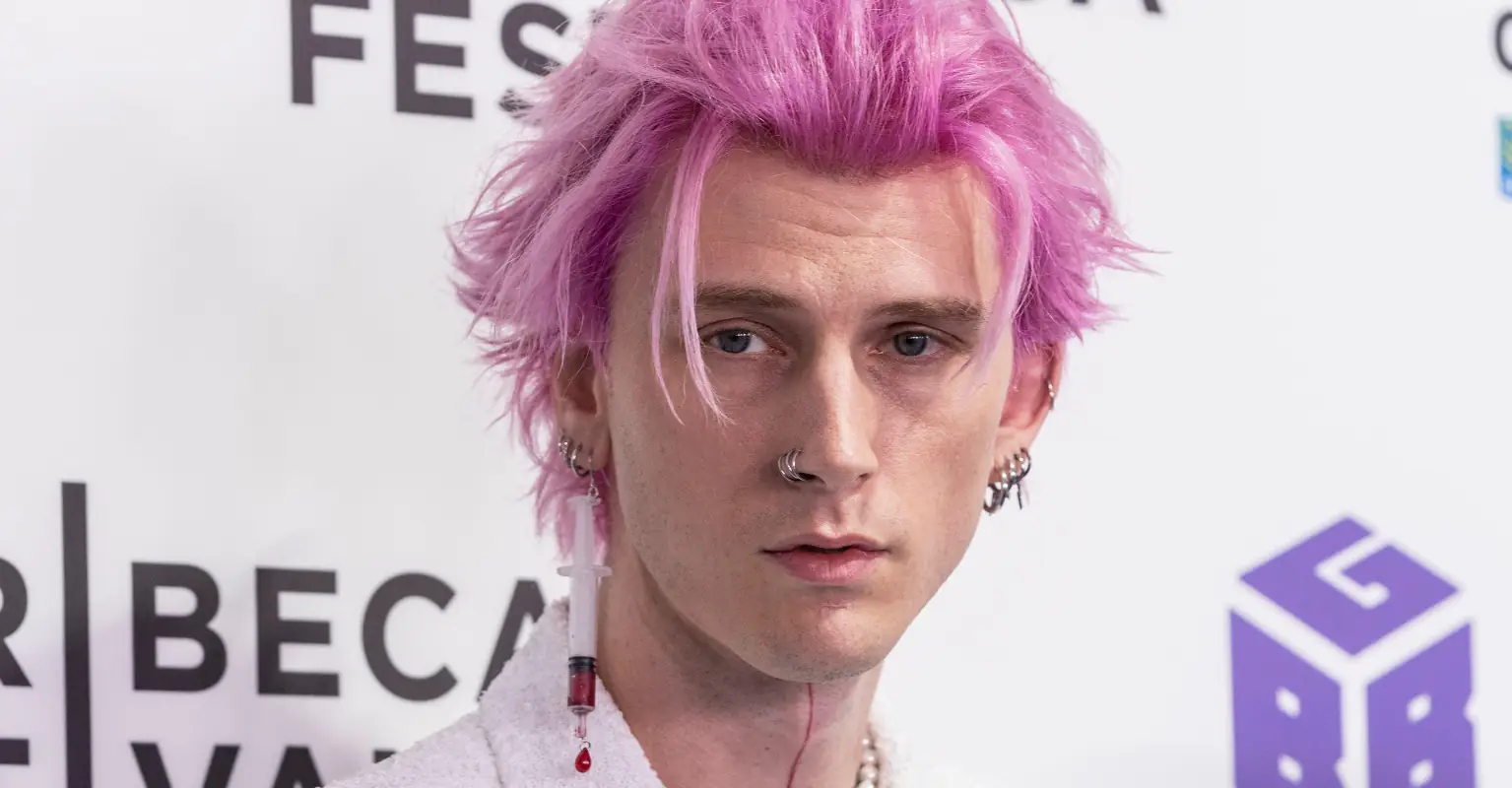 Machine Gun Kelly is slammed after attending premiere with 'syringe' earring