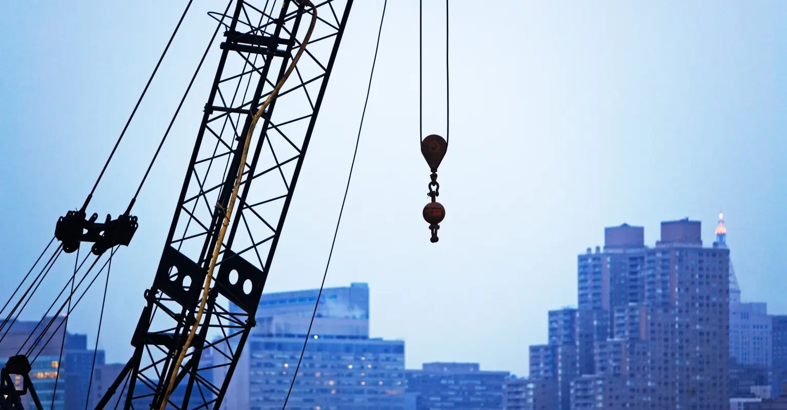 Panic as Toronto construction worker spotted dangling from crane