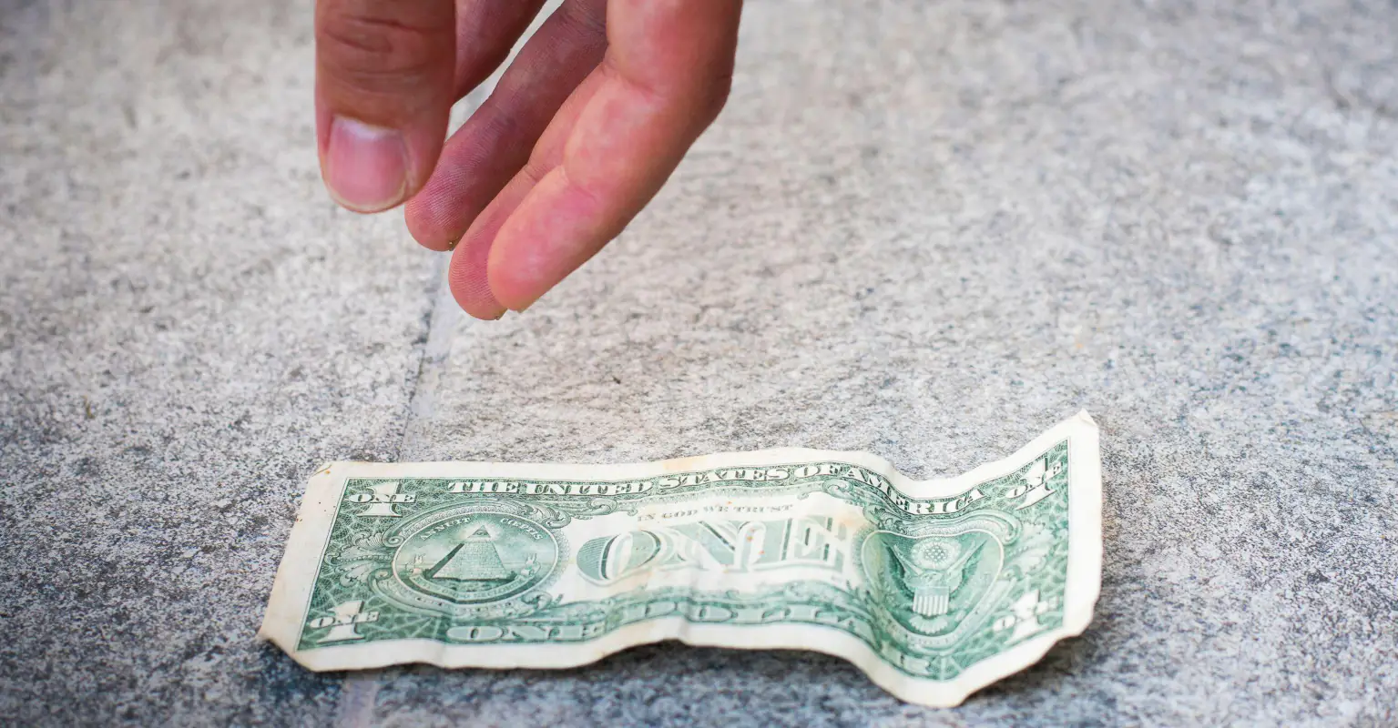 Woman says she nearly died after picking up $1 bill of the ground