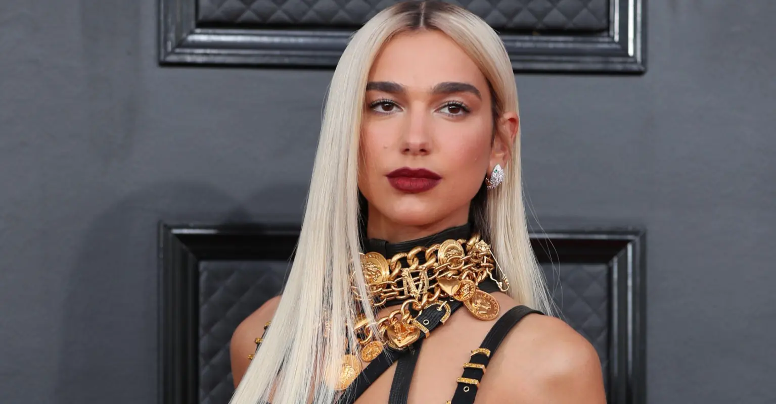 Dua Lipa sparks debate after she appears to wear white lace dress to wedding