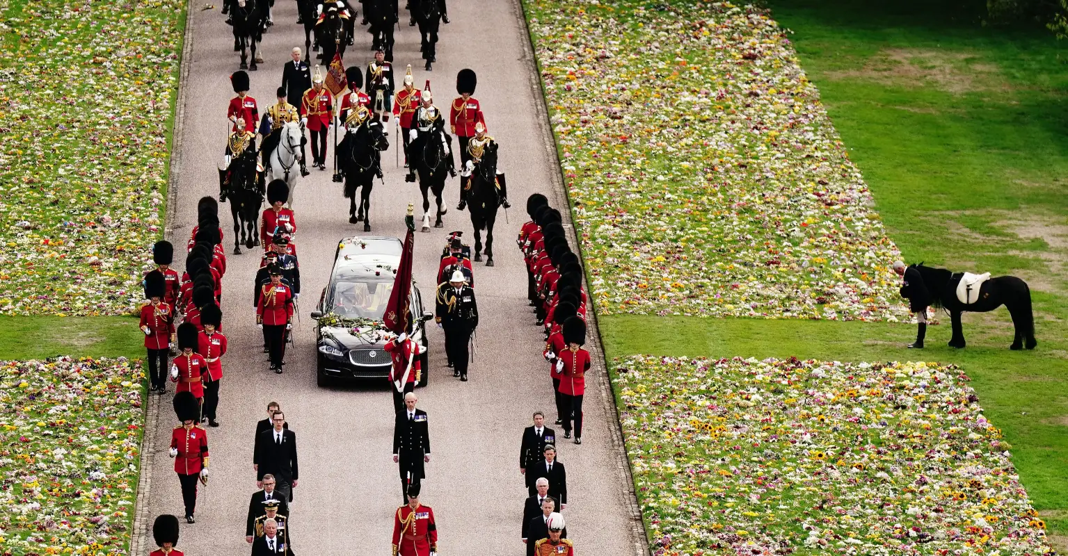 Queen's pony and corgis brought to watch her coffin go by during procession