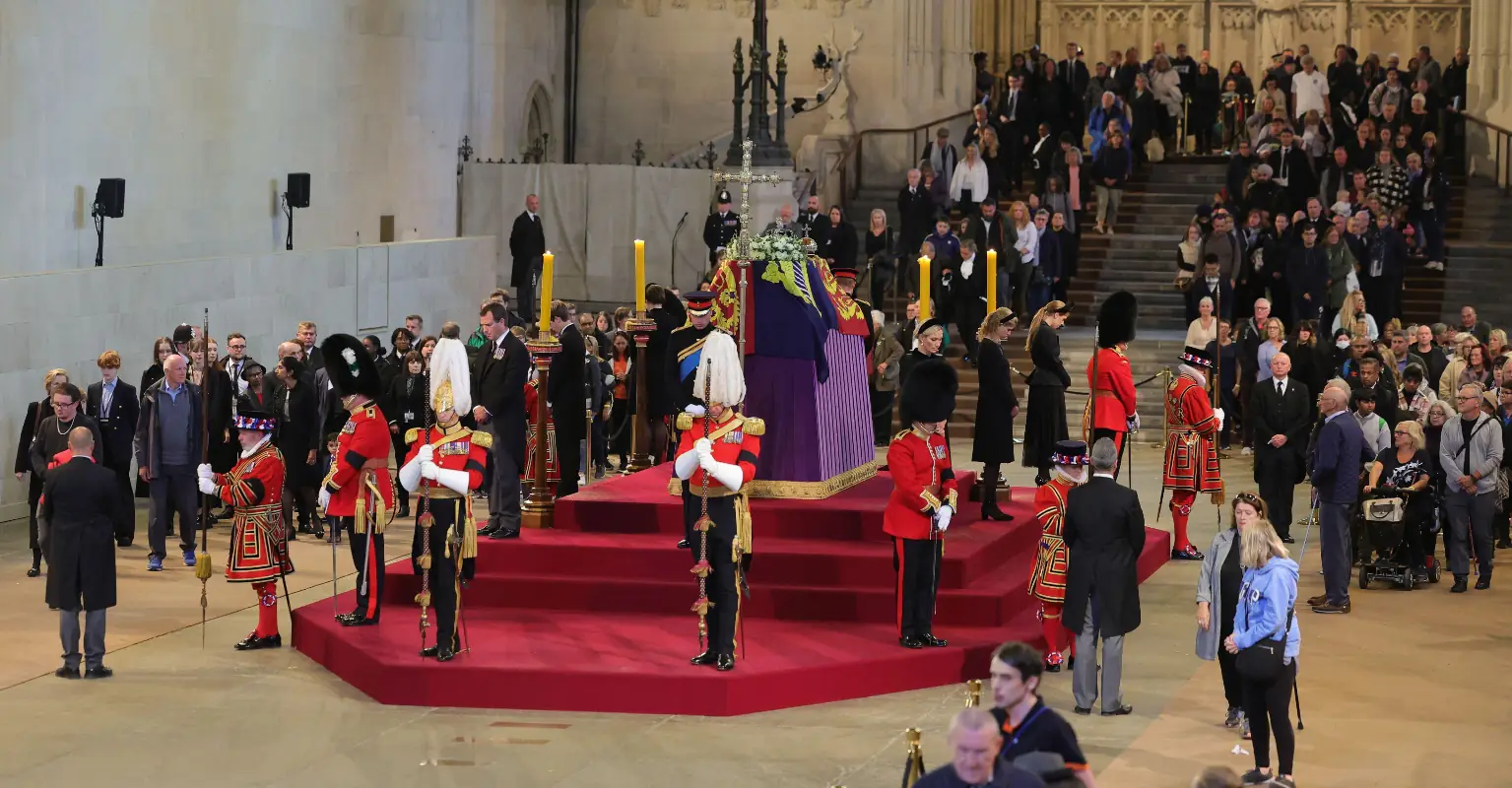 Beefeaters take a moment to rest after guarding Queen's coffin