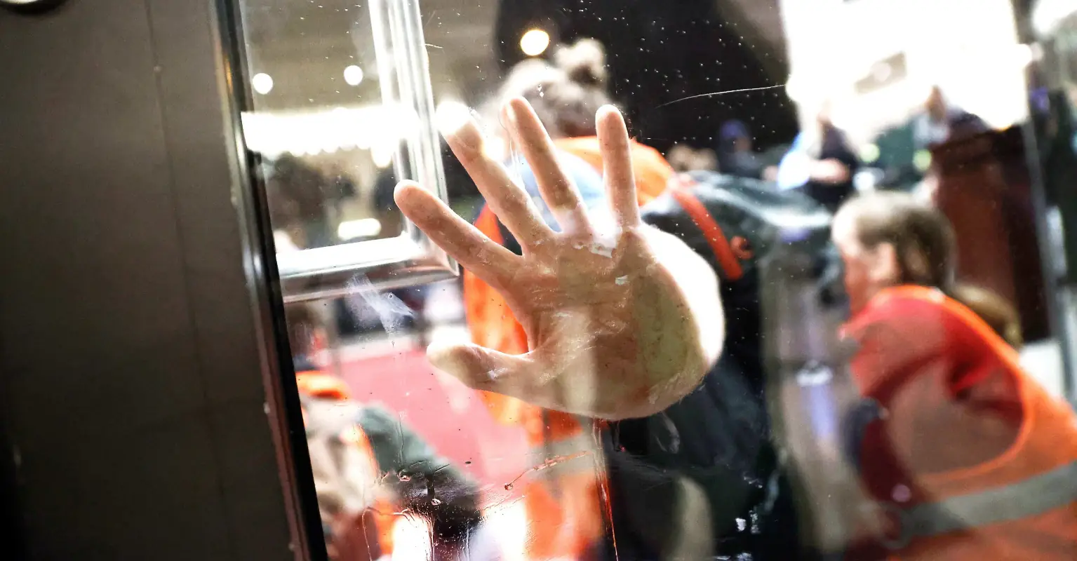 Activists who glued themselves to car dealership complain when staff turn off lights and heating