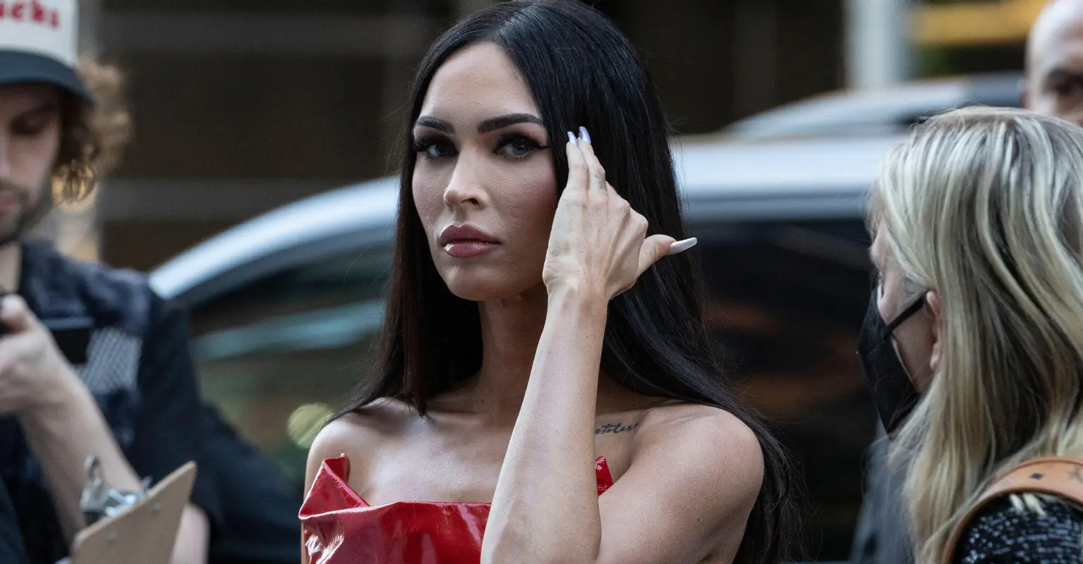 Megan Fox poses topless and slams troll who accused her of not shaving bikini line