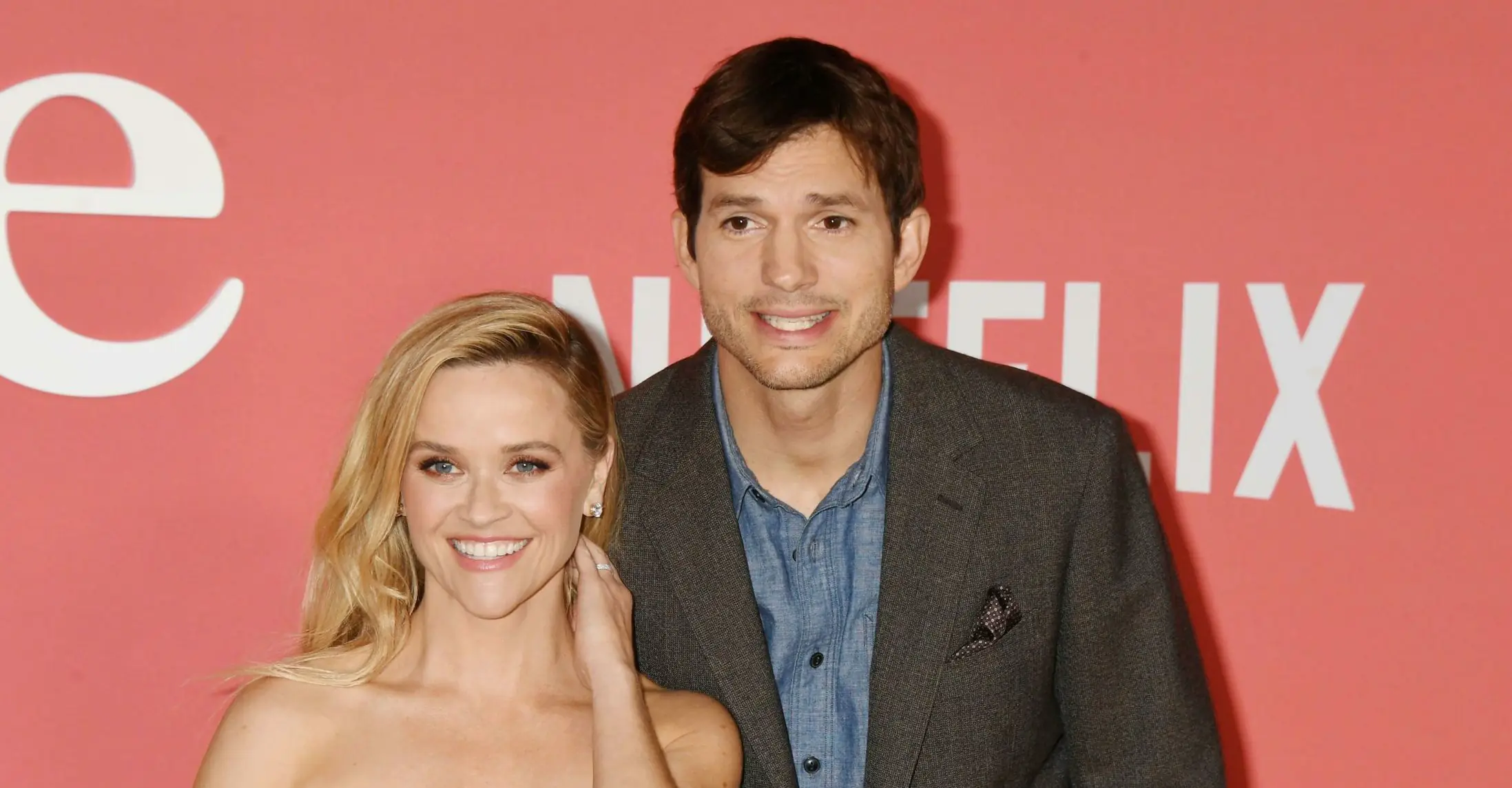 Ashton Kutcher explains why he and Reese Witherspoon look so awkward on red carpet photos together