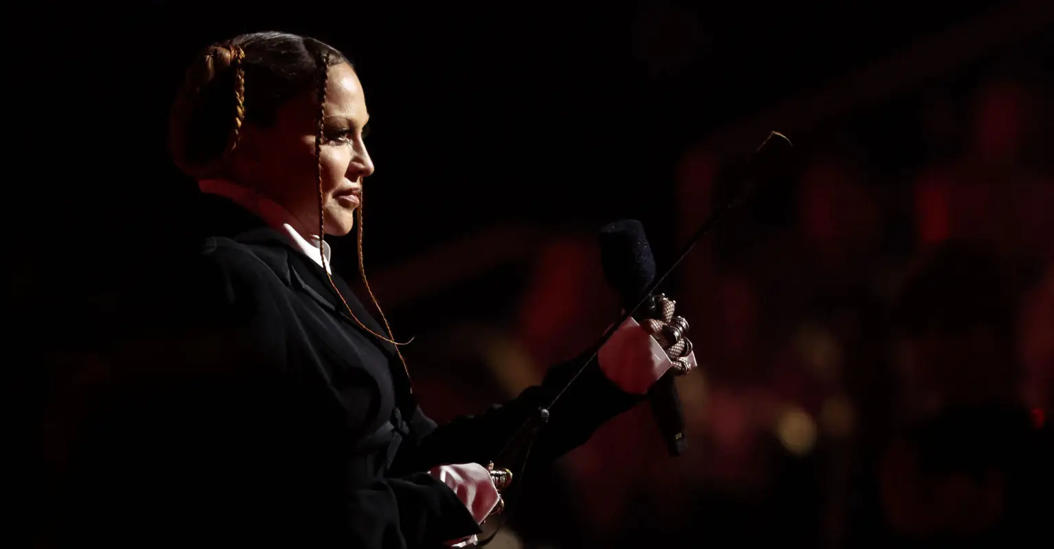 Madonna shares kiss with rapper Jozzy in raunchy behind-the-scene Grammys clip