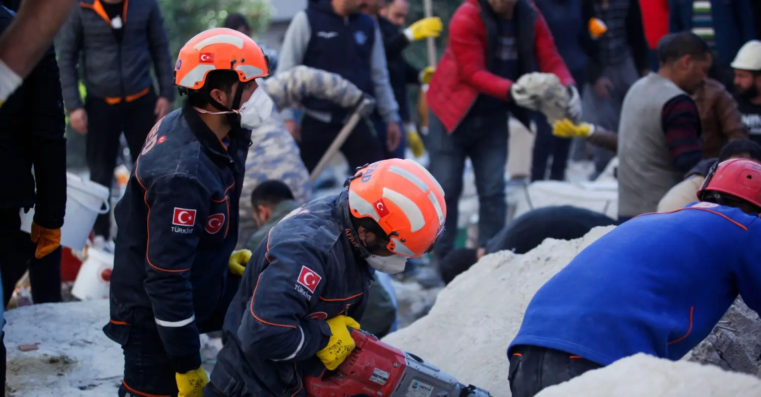 Soccer fans in Turkey throw toys onto field for young earthquake victims