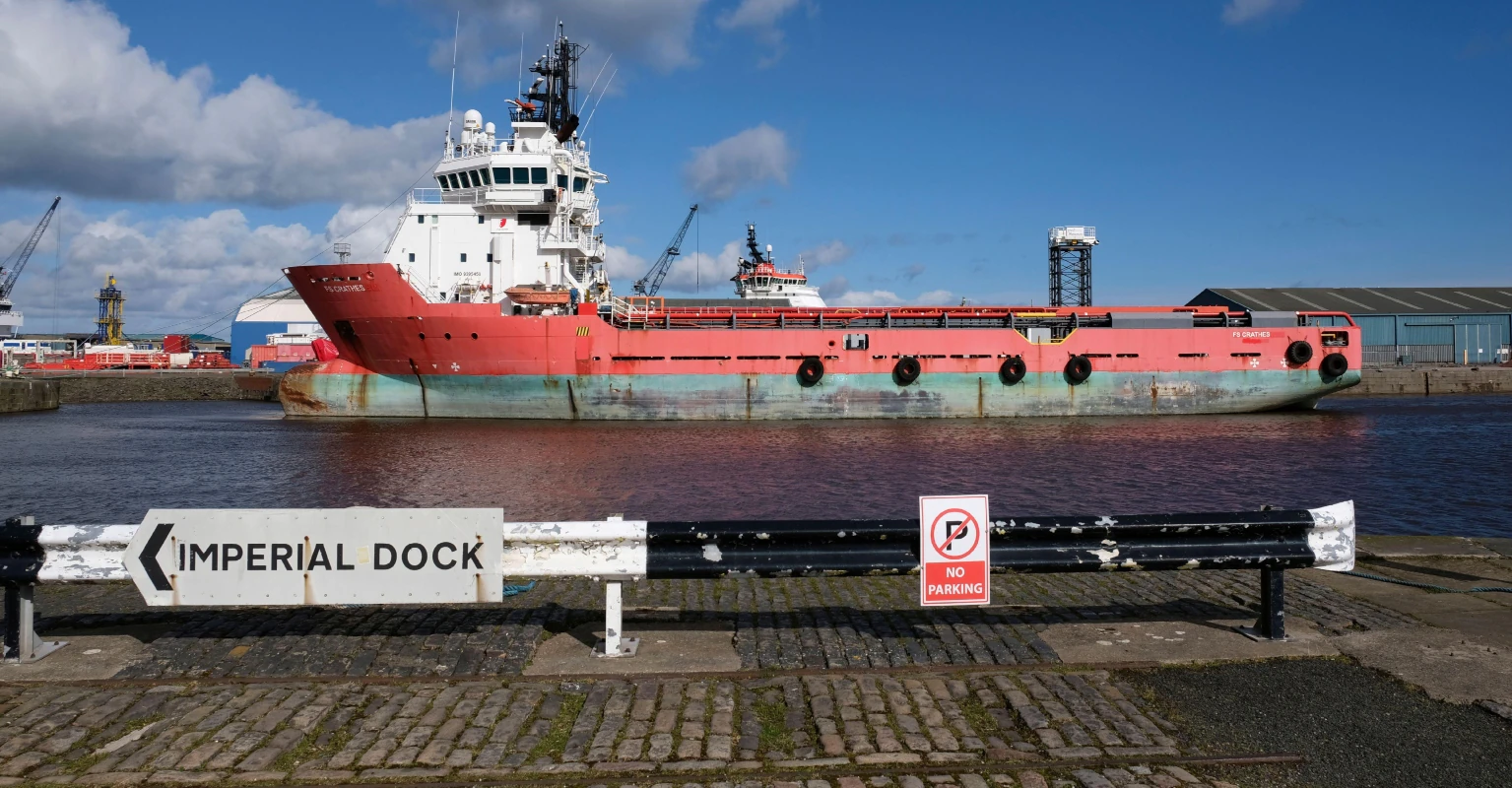 Emergency crews race to scene as huge ship tips at '45-degree angle' in dock