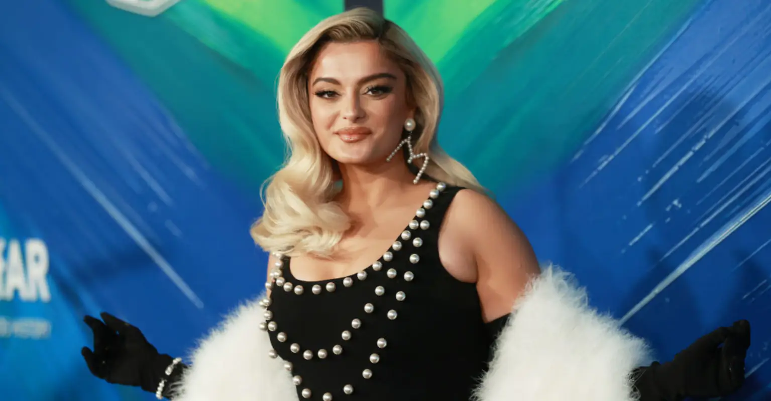 Bebe Rexha falls to her knees on stage after fan launches phone at her face