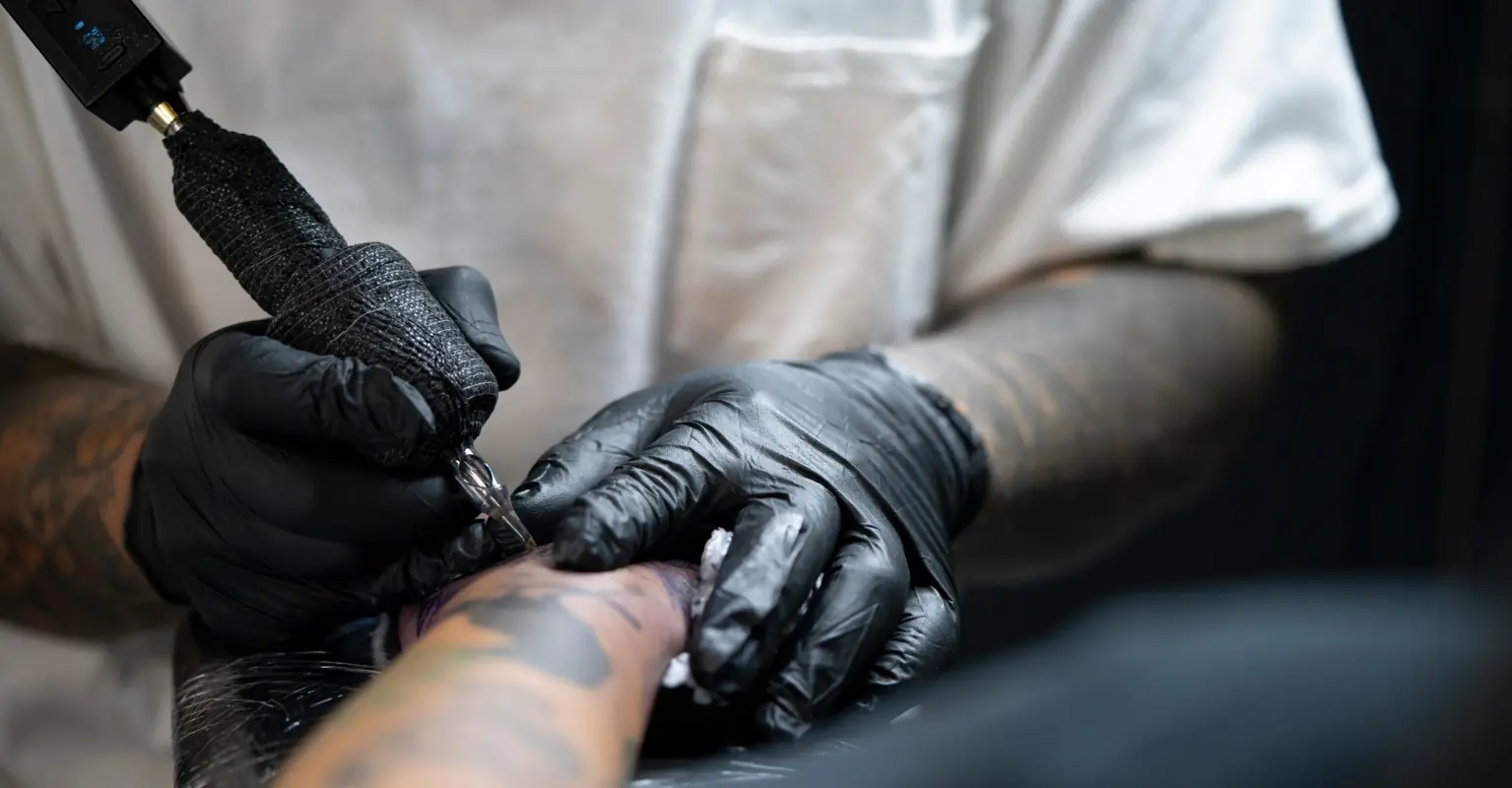 Tattoo artist defends himself after back tattoo he charged almost $1k for sparks debate
